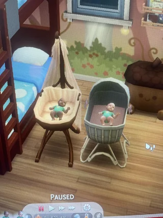 Two human baby Sims in a nursery, born to a ghost Sim in The Sims 4.