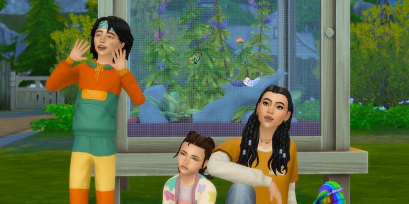 Three Sims posing in front of a display of butterflies and moths in Gibbi Point from Sims 4 Adventure Awaits