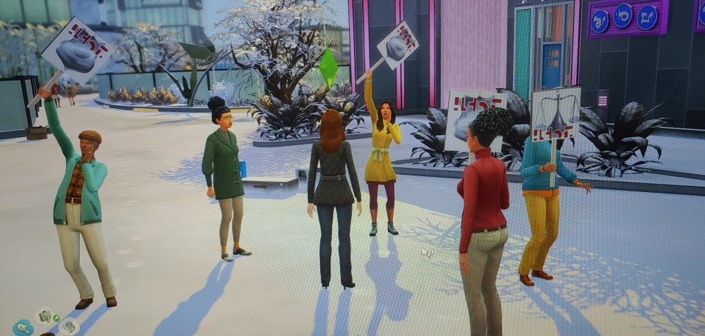 Sims attending a city protest with banners