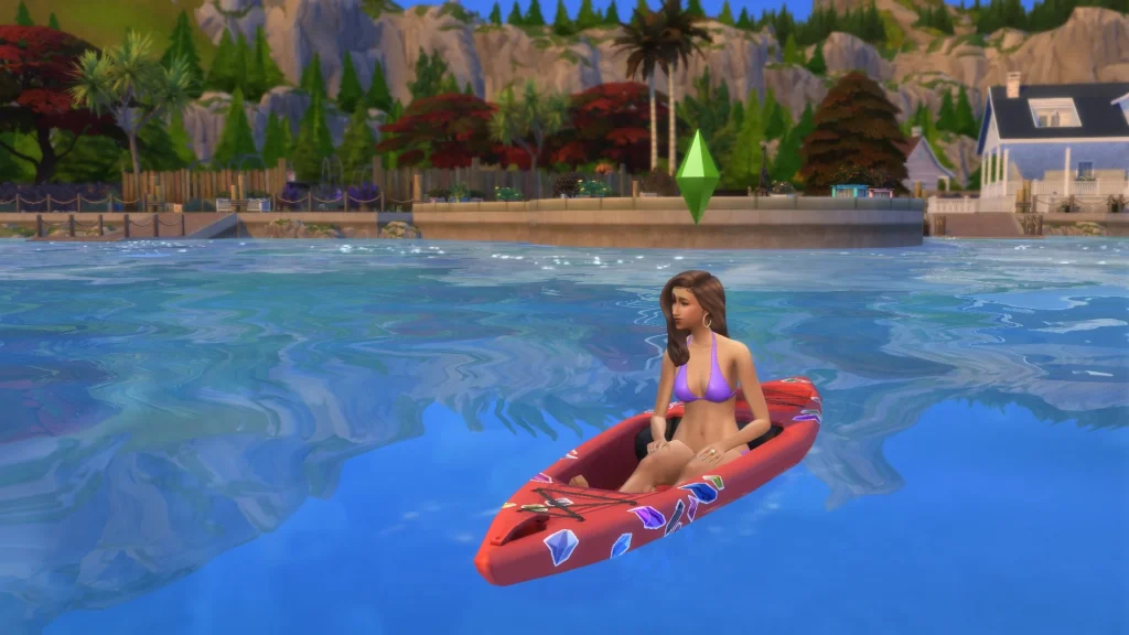 A female Sim kayaking on calm blue water with mountains, trees, and homes in the background in The Sims 4.