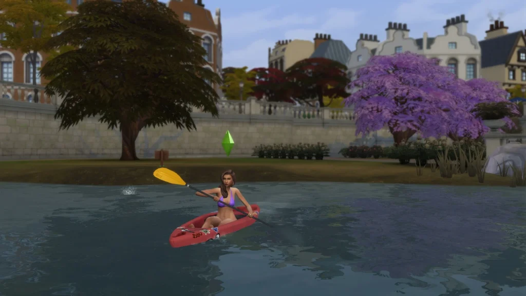 A female Sim paddling a red kayak along a calm river with trees and town buildings in the background in The Sims 4.