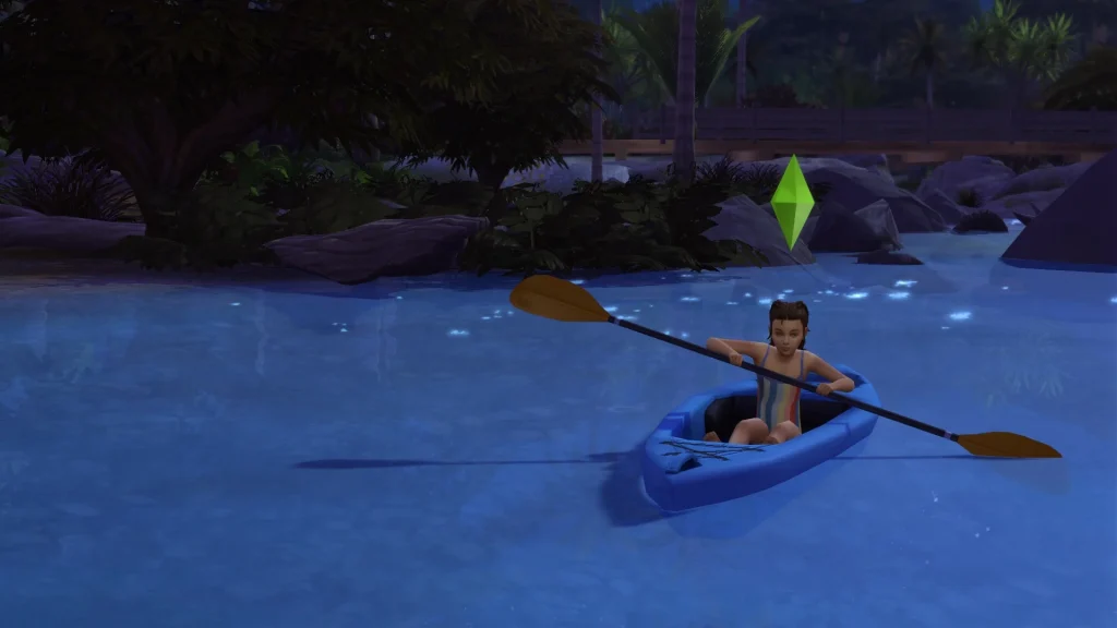 A child Sim kayaking at night on glowing blue swimmable water surrounded by trees and rocks in The Sims 4.