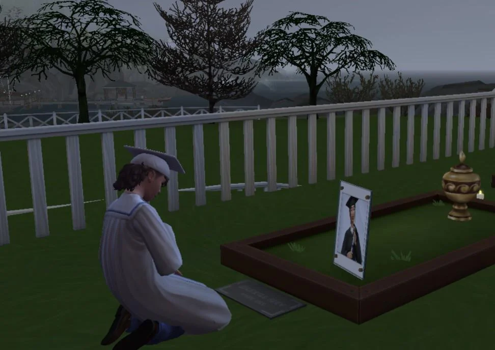 Sim in a graduation cap and gown kneels beside a grave with a framed portrait and an urn during a foggy, rainy night in The Sims 4.