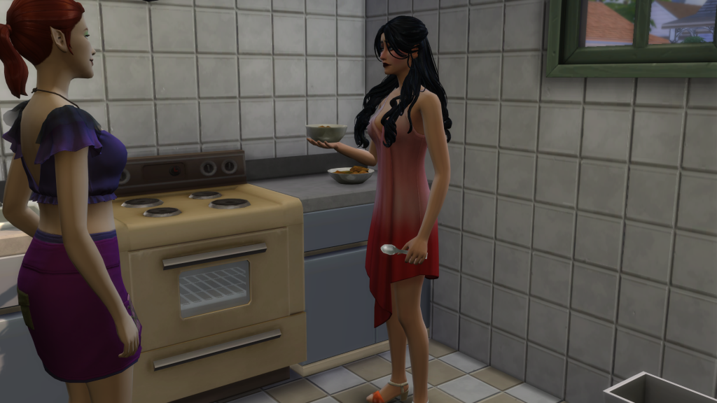 Two Sims standing close together in a small kitchen, with one Sim cooking at the stove while another gestures nearby, illustrating kitchen congestion in The Sims 4.