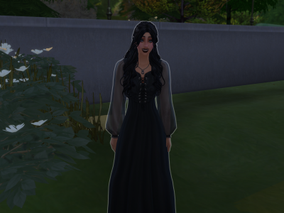 Gothic female Sim in a black dress standing outdoors near plants and greenery.