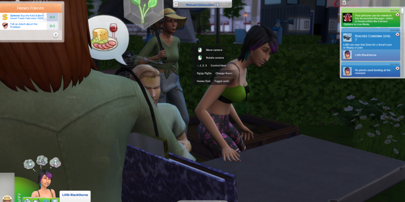 Sims in The Sims 4 having a conversation at an outdoor gardening table in a city park at night, with Lilith Blackthorne visible in the game interface.