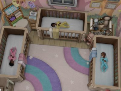 Three sleeping infants in their cribs.