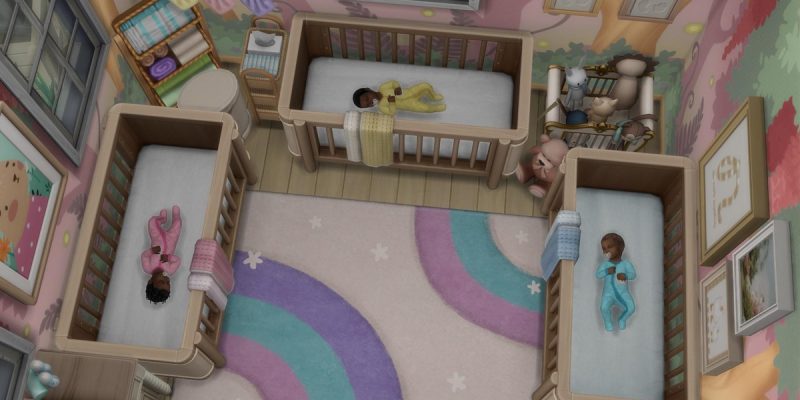 Three sleeping infants in their cribs.