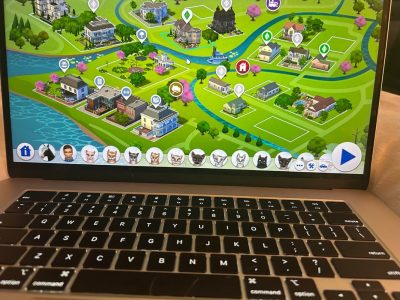 A family of cats, caused by Neighborhood stories being left on, in the Sims 4.