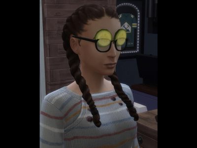 A female Sim with cucumbers under her glasses.